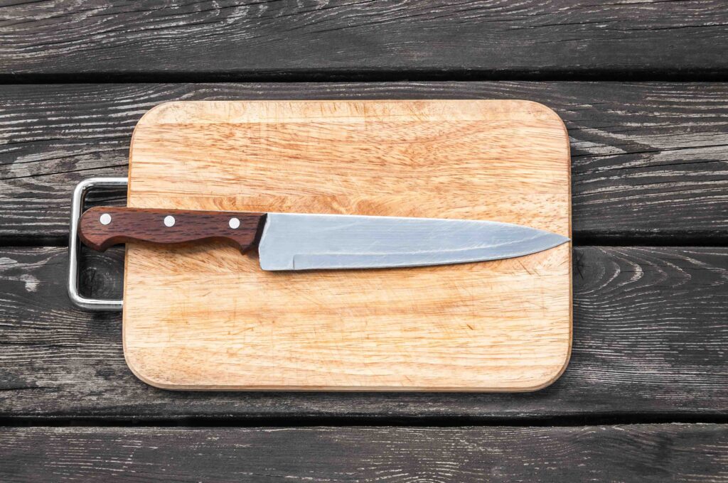 steel knife on a cutting board wooden background 2021 08 26 22 32 46 utc